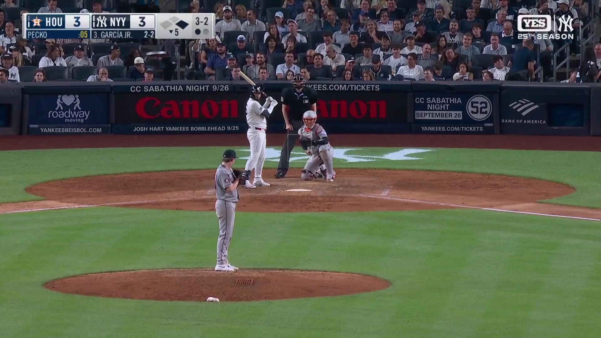 Luis Garcia Jr. of the Houston Astros rounds the bases after hitting a two-run home run off a New York Yankees pitcher, with the scoreboard showing Astros 3, Yankees 3 and on-screen graphic reading 'LUIS GARCIA JR. 2-RUN HOME RUN'.
