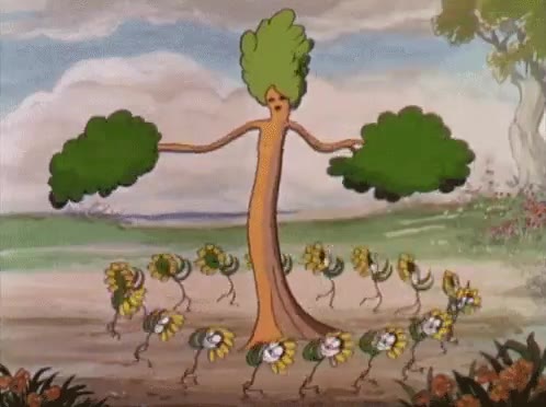 An animated tree character with green leafy hair dances with arms outstretched, surrounded by a group of dancing sunflower/daisy characters with faces, in a pastoral cartoon landscape.