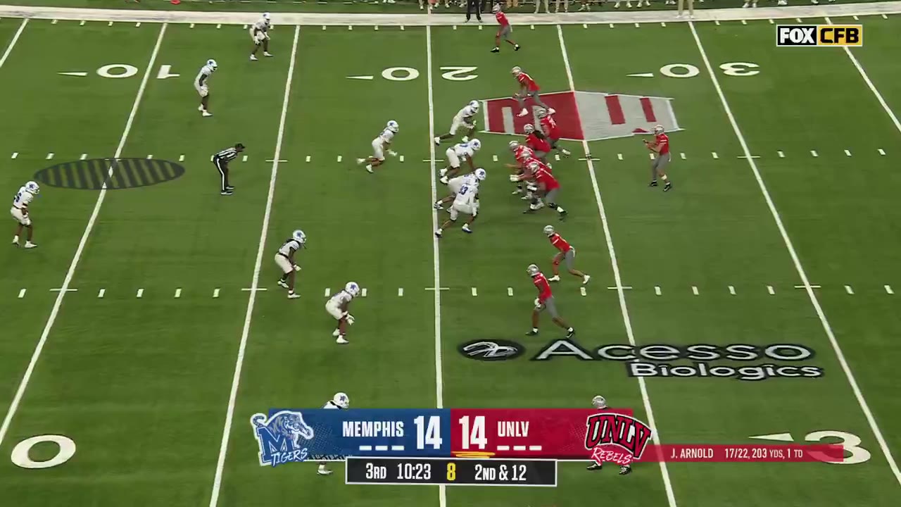 UNLV touchdown celebration on the game broadcast, with a scoreboard reading Memphis 14, UNLV 14, 3rd quarter 10:19-10:15, and an on-screen graphic naming Kayden McGee for the touchdown