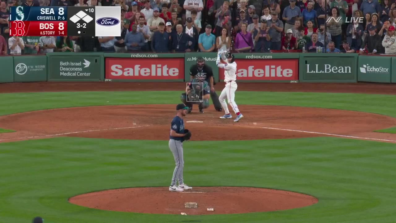 Red Sox player rounding third and scoring the winning run at Fenway Park as teammates rush in to mob him at home plate, with the scoreboard reading Red Sox 9, Mariners 8, Final 10th Inning.